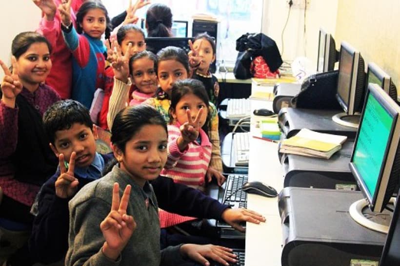 Children gathered in a computer learning centre